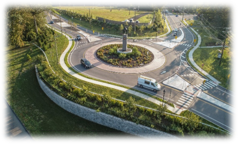 This image shows an overhead view of a 3-leg roundabout.